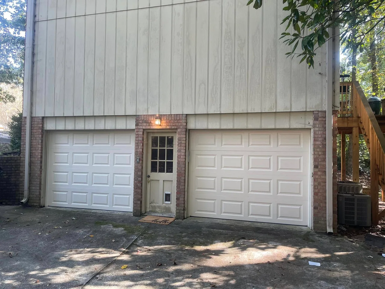 Two white doors and an entry door