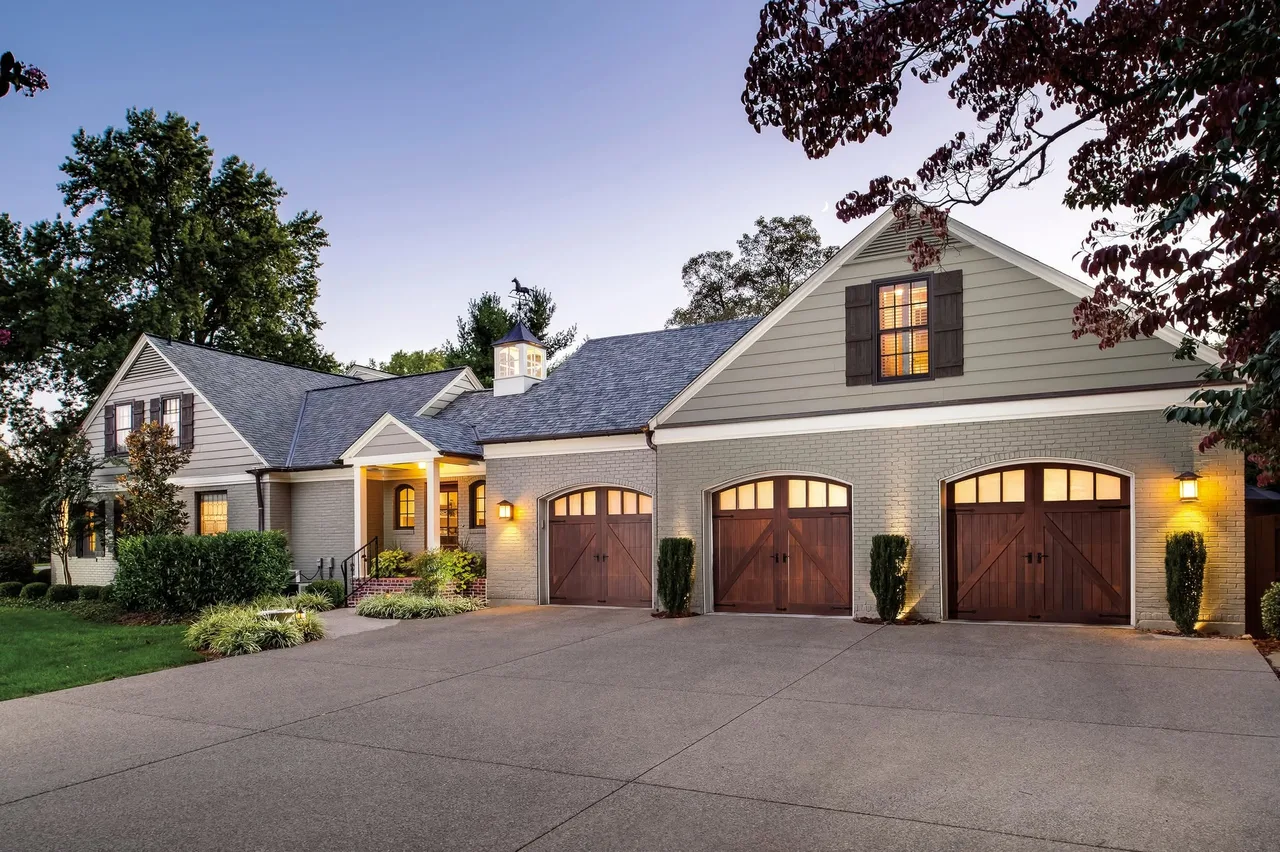 Three stained doors on a gray house